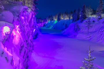Multi-colored night illumination in the old Marble Canyon. Ruskeala Mountain Park. Karelia