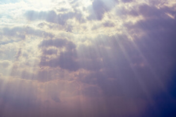 Image of back ground diffused light from the sun  Passing through the clouds in the sky and descending to the ground.