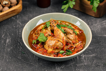 Portion of stewed chicken with vegetables