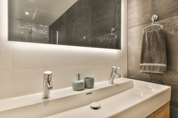 Modern bathroom sink with smart mirror display