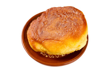 Fried homemade pancake in a plate on a white background.