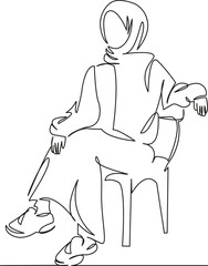 Muslim woman sitting on a chair
