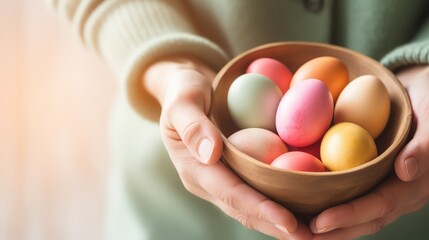 In this heartwarming photo, a basket overflows with beautifully painted Easter eggs, setting the stage for a festive and memorable gathering. A plate with Easter eggs in women's hands.