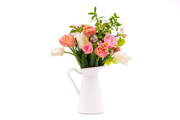 Elegant mixed pastel colored spring bouquet in white vase on white background. Spring flowers....