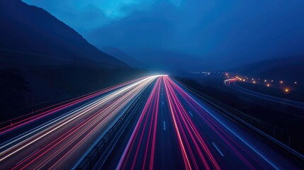 Light lines from a car on a highway among the mountains