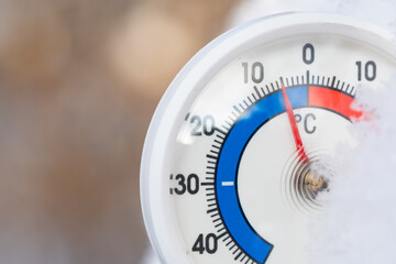 Outdoor thermometer shows sub-zero temperature