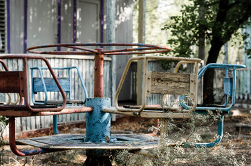 old carousel on the background of an old house