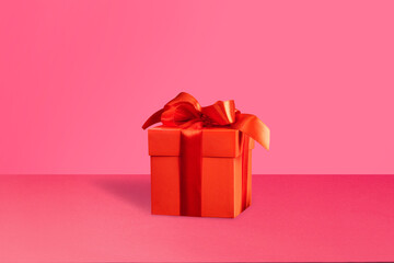 Red gift on pink background Love present copy s