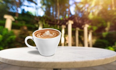 Wooden table at coffee shop  with a cup