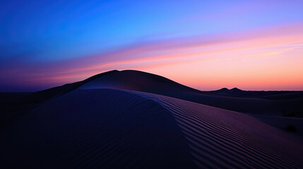 Fototapeta na wymiar The majestic form of desert dunes against the twilight sky