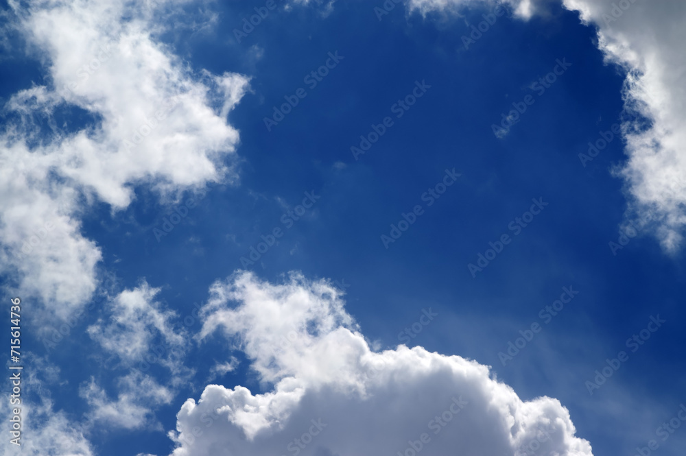 Wall mural Blue sky with sunlight clouds