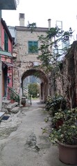 walking in Corniglia, narrow street, Liguria, Cinque Terre, Travel in Italy, winter time