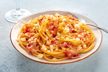 Carbonara pasta dish, traditional Italian spaghetti with pancetta and cheese, at a restaurant