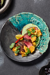 Marbled Beef Steak with Crunchy Eggplants and Wasabi Puree, an Aesthetic Top View