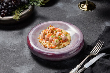 Stuffed squid with cheese sauce and nuts, aesthetically pleasing winter menu