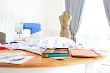 Dummy and other sewing equipment in the desighners workplace
