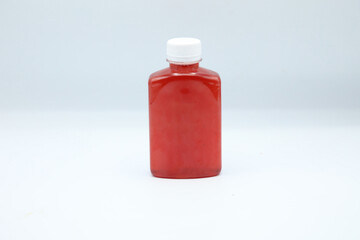 Red fruit juice in a jar.