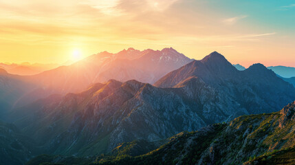 Panoramic view of towering mountain ranges at sunrise