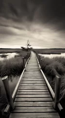 Photo sur Plexiglas Descente vers la plage Black and white photo of a wooden boardwalk in the wetlands.