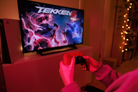 New Tekken 8 Sony PS5 console. Dualsense controller. Man holding joystick and ready to play upcoming Tekken 8