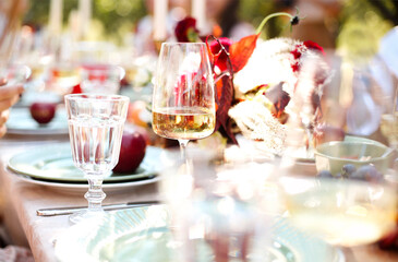 Candles and flowers on banquet table