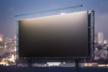 Blank black horizontal billboard on skyline background at evening, perspective view. Mock up,...