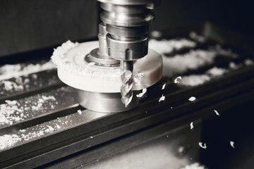 Grinding of plastic element on CNC machine. Manufacturing of the shock absorber support.