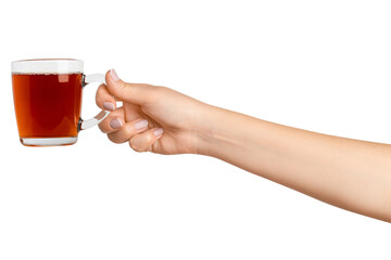 A woman's hand holds a cup of black tea with bergamot in a transparent glass cup. On a blank background