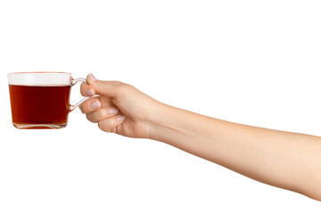 A woman's hand holds a cup of black tea with bergamot in a transparent glass cup. On a blank...