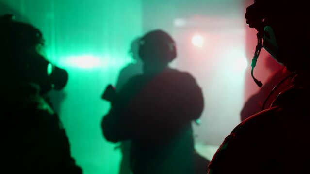 counterterrorist tactical unit working in building seized by terrorists, silhouettes of soldiers