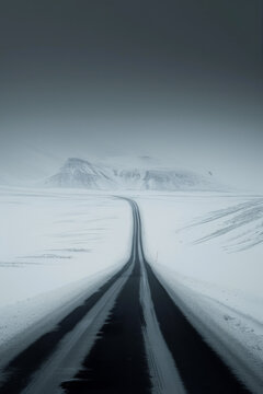 The road leading to the distance in the snowy mountains.