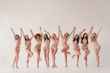 No filter photo of body positive feminists lady raise hands up have fun support people woman diversity isolated pastel color background