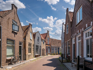 Fototapeta na wymiar Streetscene with terraced houses in Zierikzee, Schouwen-Duiveland, Zeeland, Netherlands