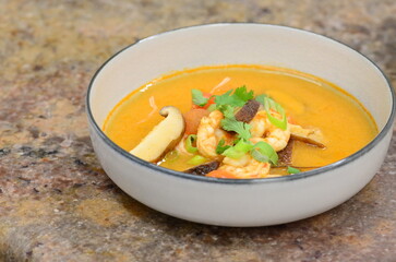 asian shrimp soup, close up view of tom yum goong