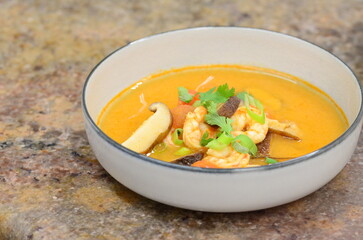 asian shrimp soup, close up view of tom yum goong