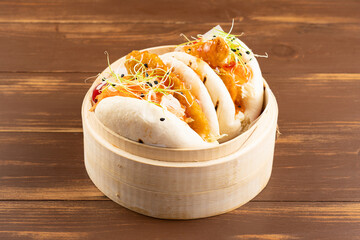 Bao buns, steamed buns with chicken and vegetable. Asian cuisine.