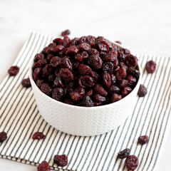 Organic Dried Cranberries in a Bowl, side view.
