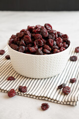 Organic Dried Cranberries in a Bowl, side view.