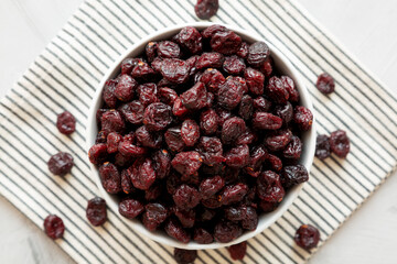 Organic Dried Cranberries in a Bowl, top view. Flat lay, overhead, from above.