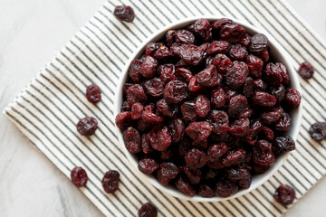 Organic Dried Cranberries in a Bowl, top view. Flat lay, overhead, from above.