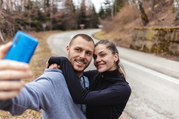 Fitness and selfie with couple in nature together for health, wellness and exercise. Smile, motivation and sports training with young man and woman for workout, running and happy.