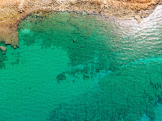 Aerial top view by drone of the rocky beach.