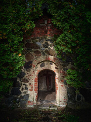 Fototapeta na wymiar Old chapel on old cemetery in Europe.