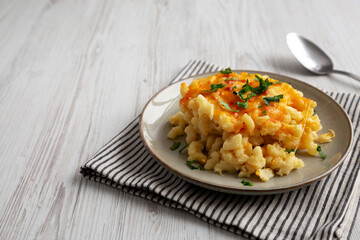 Homemade Baked Mac and Cheese on a Plate, side view. Copy space.