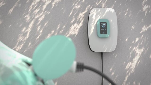 Charging an electric vehicle at home with a home charging station (wallbox). Focus on the wallbox displaying status information. Shadows being cast by moving tree branches. Selective focus.