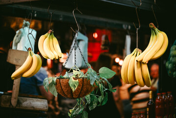Bananas and plant basket hanging on in a market