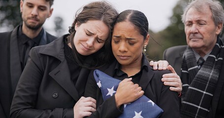 Funeral, death and support for a woman with a flag at a cemetery in mourning at a memorial service. Sad, usa and an army wife as a widow in a graveyard feeling the pain of loss or grief with a friend - obrazy, fototapety, plakaty