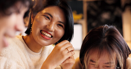 Japanese friends, laughing and talking in restaurant for dinner, vacation and hungry to order healthy food. Women, man or happy together on lunch in tokyo city or funny joke by bonding in coffee shop - obrazy, fototapety, plakaty