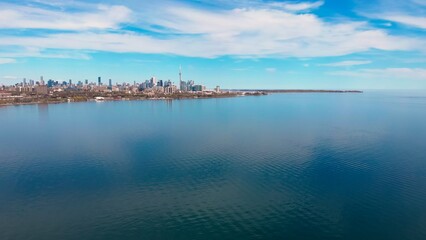 North American city beside lake, clear day, epitomizes business life. Business life thrives...
