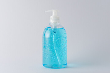 Hand sanitizer in a bottle on a bright background. Coronavirus prevention concept.